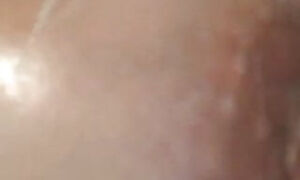Steamy cougar plays with her hooters in the bathroom