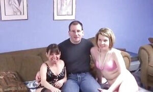 Nerdy pervert gets lucky and fucks two lingerie babes in bed