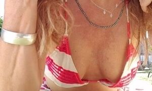 nippleringlover horny milf sunbathing in sexy bikini flashing pierced nipples and pussy outdoors