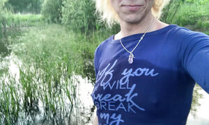 Transgirl Alexa Cosmic soaking and swimming in denim shorts and top and nude in the lake
