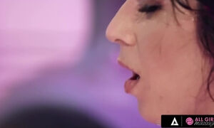 Two bombshell brunette babes indulge in a wild lesbian sex with lots of licking and scissoring