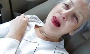 Beautiful granny masturbates in her car