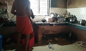 Indian Malayali housewife is fucked doggy style by her husband at home in the kitchen.
