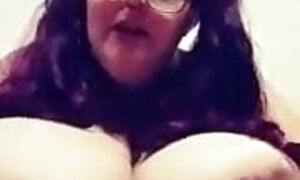 BBW with pigtails and huge tits playing with her breast