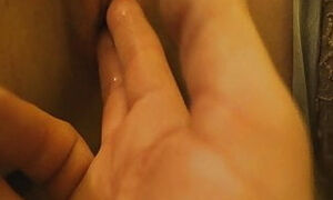 Moaning while fingering her wet mature pussy