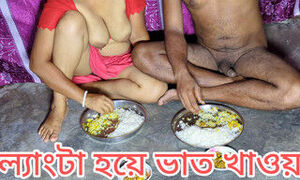 Indian husband and wife eat food