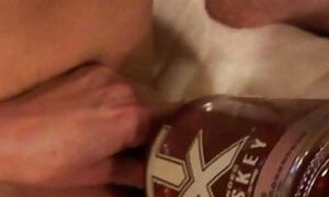 Jacking with a bottle of whisky in my gash