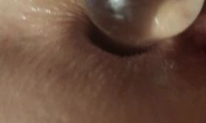 Short clips of my wife with her toys in her ass and pussy, with an anal spreader, and she squirts