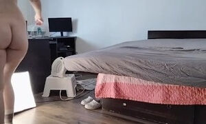 Amateur wife having fun trying on clothes that she cuts off.