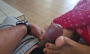Playing with his cum after a casual feet job