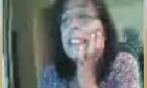 Amateur mature brunette lady on webcam flashes her tits